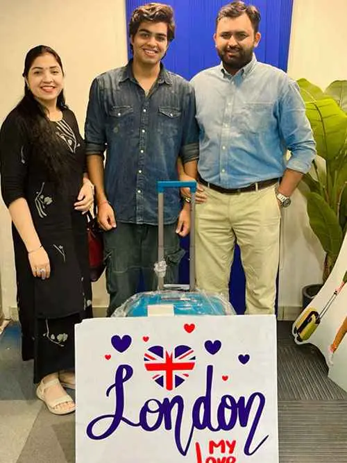 Family showing their love for London, UK, with sky blue colored luggage. 