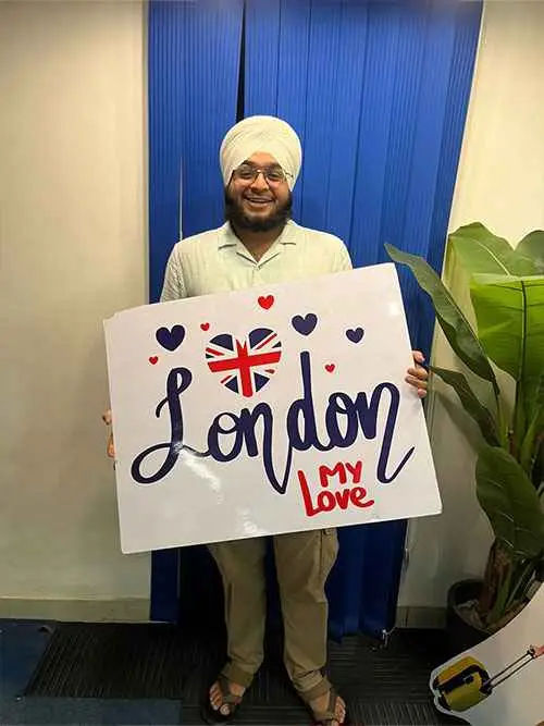 smiling Sikh guy holding a London, My Love board